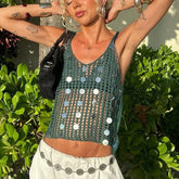Women's green knit sequin tank top with a short length.
